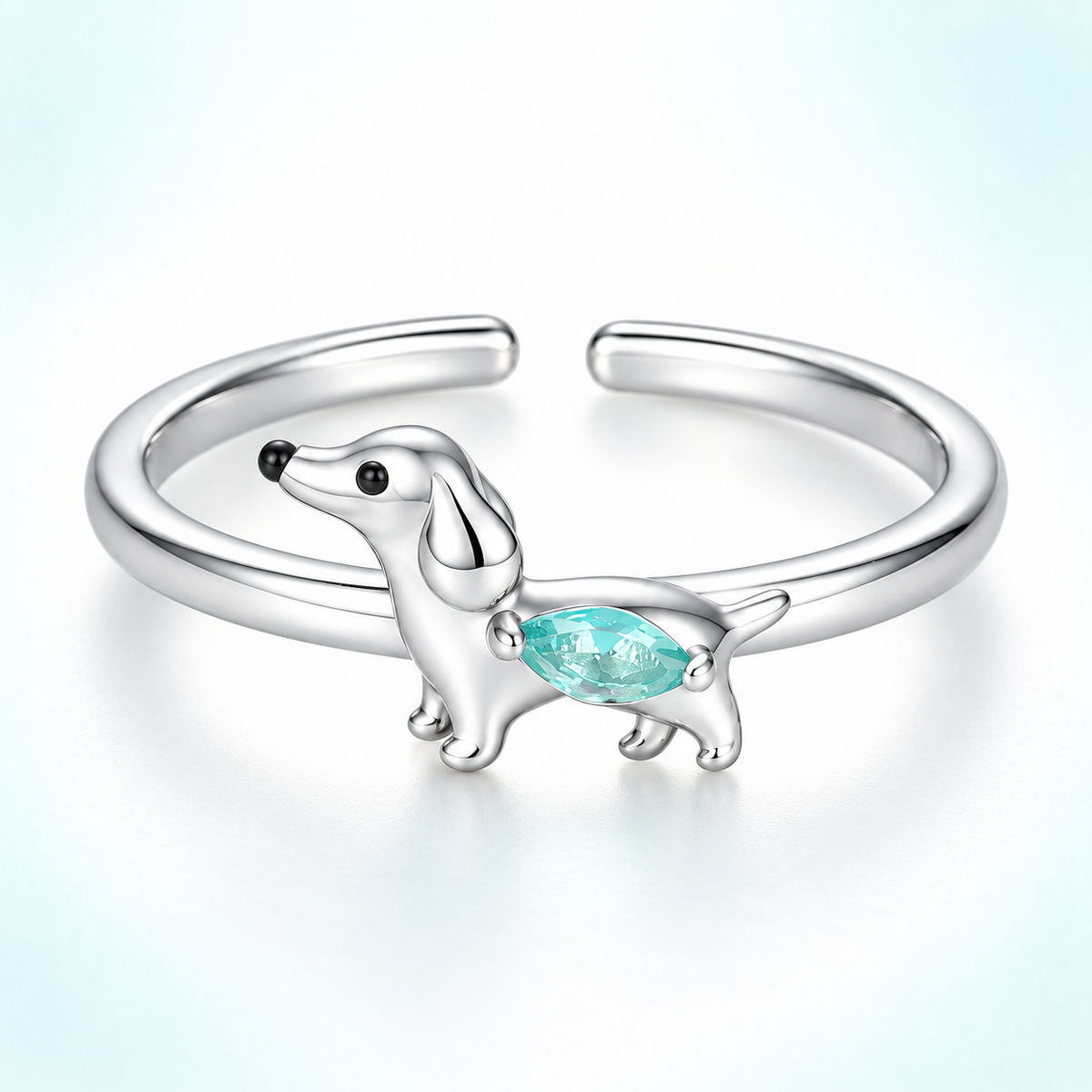 Dachshund Crystal Adjustable Ring in polished silver with pale aqua crystal, shown on a light background