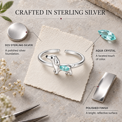 Sterling silver, aqua crystal and polished finish details of the dachshund ring