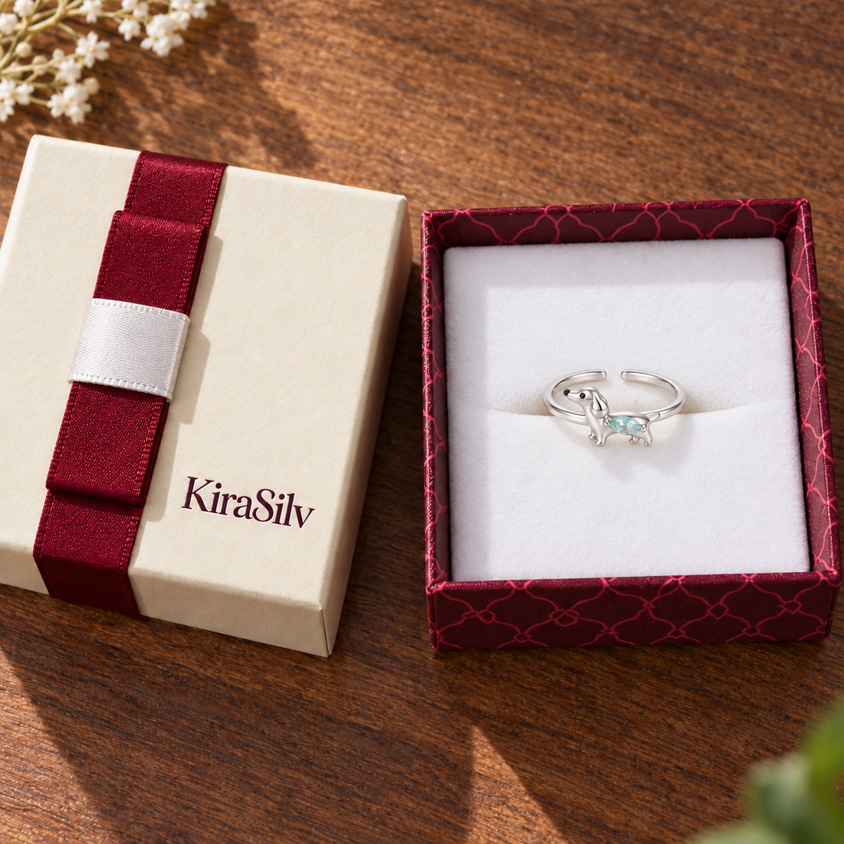 Small Dachshund Crystal Adjustable Ring presented inside the cream and burgundy KiraSilv gift box